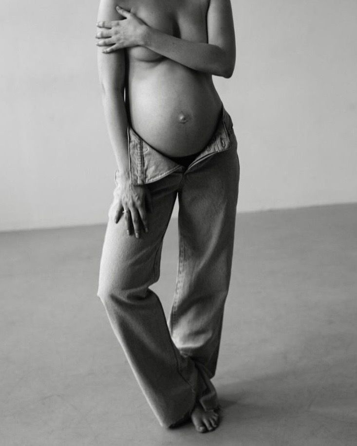 A pregnant surrogate in soft natural light
